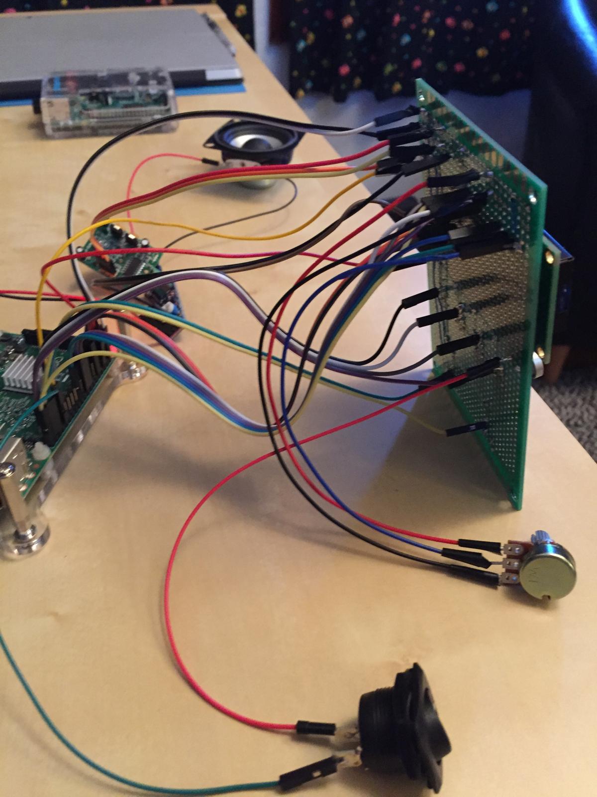 The front panel wired back to the Raspberry Pi, amplifier, and speaker