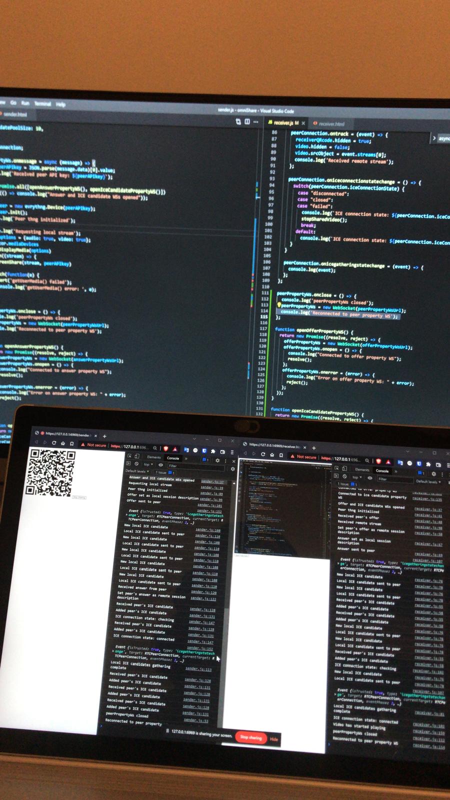 The Omnia Share code — sender.js and receiver.js — open in VS Code above two laptops running the sender and receiver, WebRTC logs streaming in their consoles.