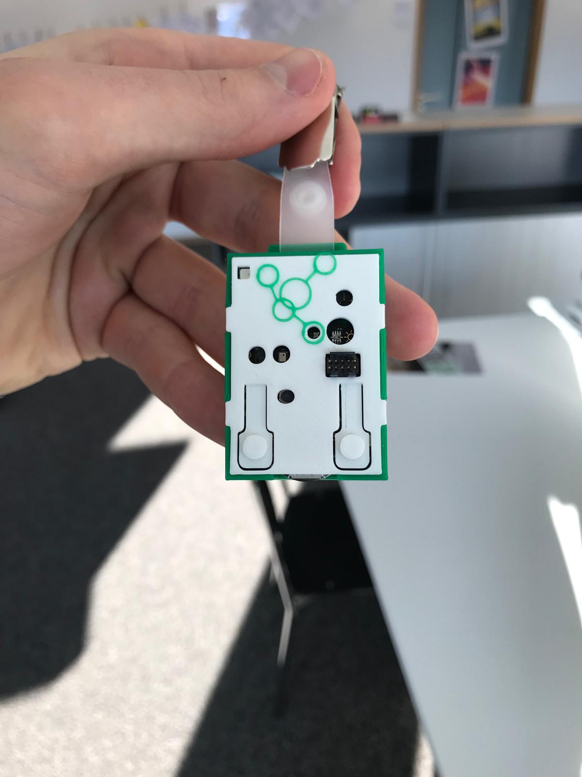 The little badge — an Omnia-branded board on a lanyard — that people in the lab wore so the system could identify them and record their preferred work environment.